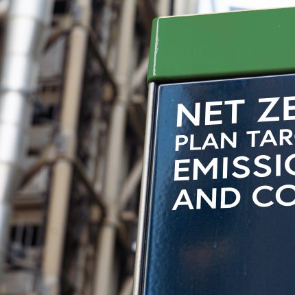 Net,Zero,Plan,Targets,Emissions,And,Costs,On,A,Sign